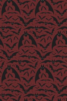 a red and black background with bats