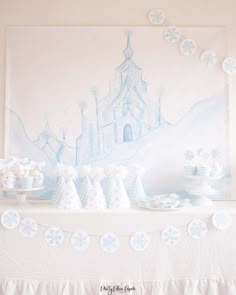 the prettiest winter printable party set is displayed on a table with white and blue decorations