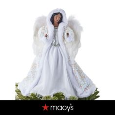 an angel figurine with white fur and wings