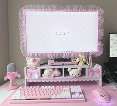 a desk with a keyboard, mouse and monitor on it in front of a computer screen