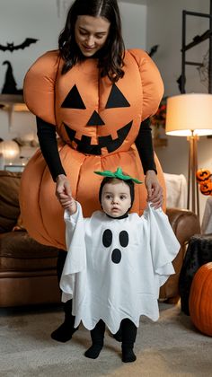 a woman and child dressed up in halloween costumes