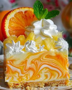 a slice of orange swirl cheesecake with whipped cream and fruit toppings on top