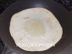 an uncooked tortilla in a frying pan