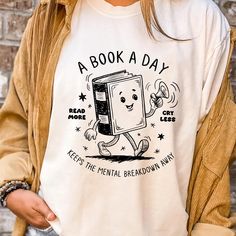 A Book A Day Keeps The Mental Breakdown Away Shirt, Read Book More Sweater, Bookworm Gift, Librarian Gift, Book Lover, Retro Bookish Shirt ORDERING: 1. Review all photos 2. Choose Size and Color from drop-down menu 3. If personalization box is available, add your text color 4. Add each shirt to cart one at a time 5. Click "Add to Cart" - you can go back to add more products 6. Click "Proceed to Checkout" 7. Add note to seller for any requests BULK DISCOUNTS AND SPECIAL REQUESTS: We offer bulk discounts and are open to special requests. Please feel free to direct message us with any inquiries. CARE INSTRUCTIONS: Wash inside out, gentle cycle, cold water, tumble dry low, medium iron. PRODUCTION AND SHIPPING: Processing time is next day. First Class Shipping is 2-5 business days (after proces Bookish Shirts, Book Clothes, Book Tshirts, Gifts For Librarians, Librarian, Books To Read