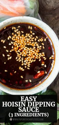 a white bowl filled with food on top of a wooden table next to carrots