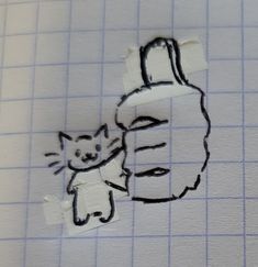 a piece of paper with a drawing of a cat and a person's head