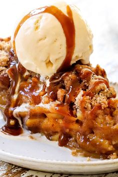 a slice of pecan pie on a plate with ice cream and caramel drizzle