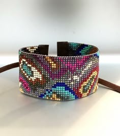 a close up of a bracelet on a table