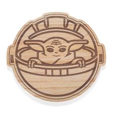 a wooden coaster with an image of yoda in a barrel