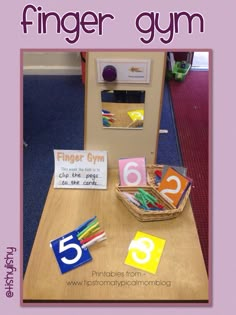 a wooden table topped with lots of different types of crafts and writing on top of it