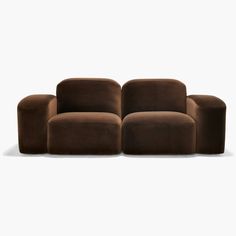 a brown couch sitting on top of a white floor