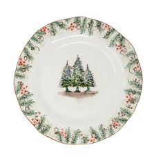 a christmas tree plate with holly and berries on the rim, decorated with pine trees