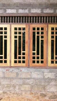 an old building with wooden windows on the outside