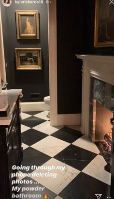 a black and white checkered floor in a bathroom with an open fire place next to the fireplace