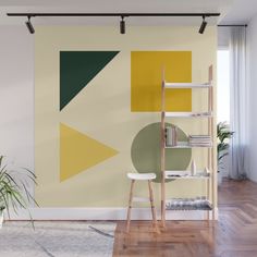 a room with a book shelf, plant and wall mural on the wall that has an abstract geometric design