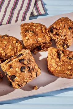 several pieces of fruit and oatmeal muffins on a plate