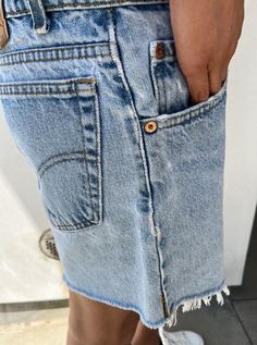 One of a kind authentic vintage Levis. This waist measures 32” around the top and hangs low on the hip with a zip closure. From top button to bottom of short measures 14”. No visible holes and wash is consistent with vintage Levis. Frayed at the bottom of short. Fits women’s size 26 very loosely, 27-28 perfectly. Vintage is final sale. Retro Straight Leg Shorts With Pockets, Vintage Jeans With Built-in Shorts For Spring, Levi's Straight Leg Jean Shorts With Pockets, Vintage Straight Leg Cotton Shorts, 90s Levi's Denim Bottoms, Vintage Cotton Straight Leg Shorts, Spring Cutoff Shorts With Hip Pockets, Fitted Levi's Jean Shorts With Frayed Hem, Retro Straight Leg Bottoms With Frayed Hem