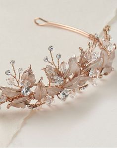 a close up of a tiara on a white surface