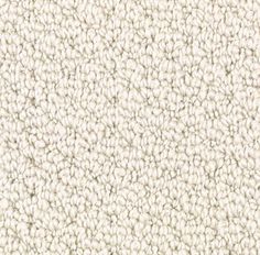 an up close shot of the texture of a carpet with white and beige colors on it