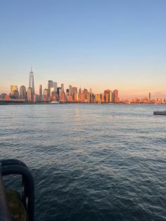 the city skyline is seen from across the water