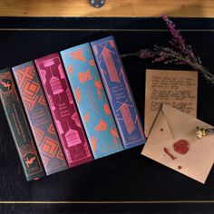 an envelope and some books on a table