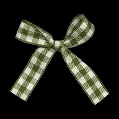 a green and white checkered bow on a black background