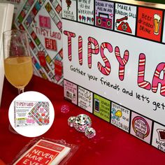 a table topped with candy and drinks next to a sign that says tastyland