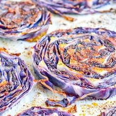 purple cabbage on a baking sheet ready to be cooked in the oven for roasting