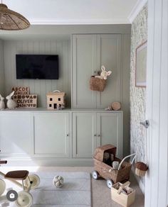 a living room filled with lots of furniture and decor on top of a white rug