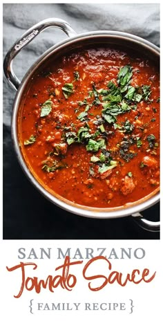 a pan filled with tomato sauce on top of a table