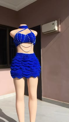 a mannequin wearing a blue skirt and top