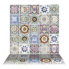 an artistic tile design with many different colors and shapes