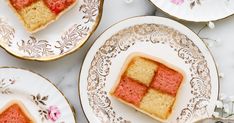 three pieces of cake on plates with pink flowers