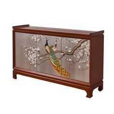 a wooden box with a painting of a peacock on it