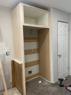 an unfinished closet is being built in a house