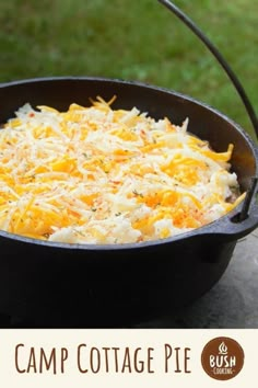 cottage pie in a cast iron skillet on a picnic table with text overlay that reads cottage pie