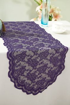 the table is covered with purple lace