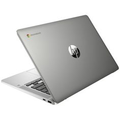 an open laptop computer sitting on top of a white surface