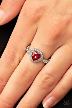 Bordered in a glassy frame of dainty white rhinestones, a fiery red heart shaped gem sparkles atop a silver band dotted in brilliant white rhinestones for a romantic finish. Features a dainty stretchy band for a flexible fit.

 Sold as one individual ring. Paparazzi Accessories Jewelry, Jewelry Catalog, Rhinestone Ring, Paparazzi Accessories, Fiery Red, Rhinestone Heart, White Rhinestone, Red Rhinestone, Pink Ring