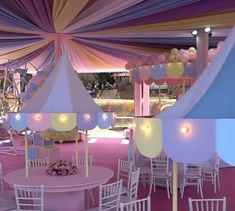 the inside of a tent with tables and chairs