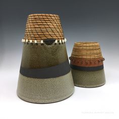 two brown and green hats sitting next to each other