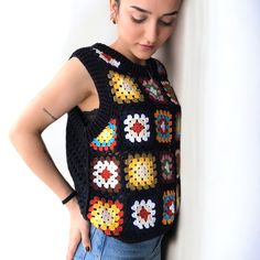 Casual Sleeveless Granny Square Top, Sleeveless Crochet Cotton Sweater Vest, Sleeveless Cotton Crochet Sweater Vest, Casual Hand Knitted Knit Vest, Crochet Knit Sleeveless Vest, Casual Hand Knitted Vest, Multicolor Sleeveless Granny Square Top, Fitted Sleeveless Granny Square Crochet Top, Sleeveless Crochet Knit Vest