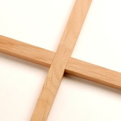 a wooden cross on a white background