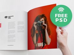 a person holding up a book with an image of a woman on it and the text free psd