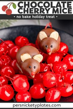 two chocolate mouses sitting on top of cherries in a bowl with text overlay that reads chocolate cherry mice no bake holiday treat