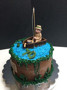 there is a cake with a fisherman on it