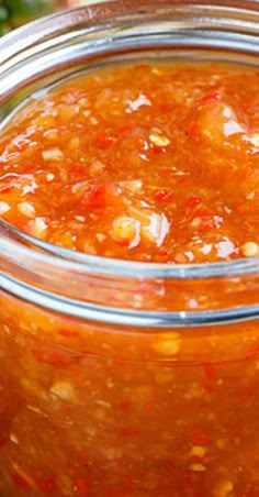 a jar filled with lots of food sitting on top of a table