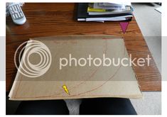 a cardboard box sitting on top of a wooden table