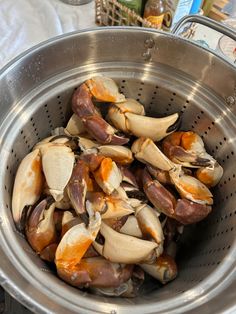 a metal strainer filled with lots of cloves