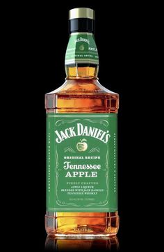 a bottle of jack daniels'tennessee apple whiskey on a black background with the caption jack daniels'tennessee apple